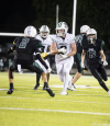 Port Washington High School’s Aiden Mitchell made his way downfield during the Pirates’ 50-29 victory in Kewaskum on Friday, Sept. 19.